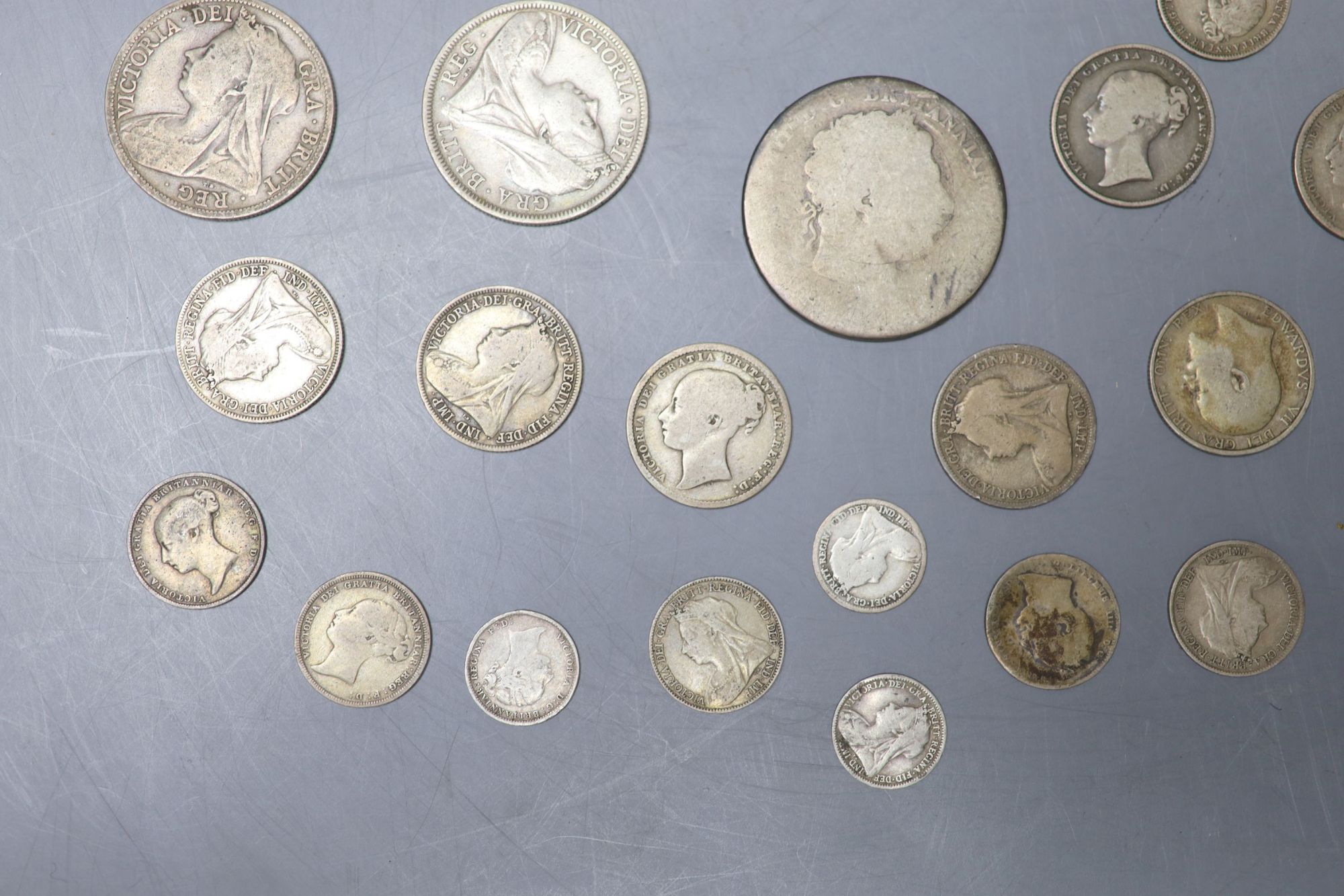 A collection of UK and world coins including George IV - George V silver threepences to halfcrowns